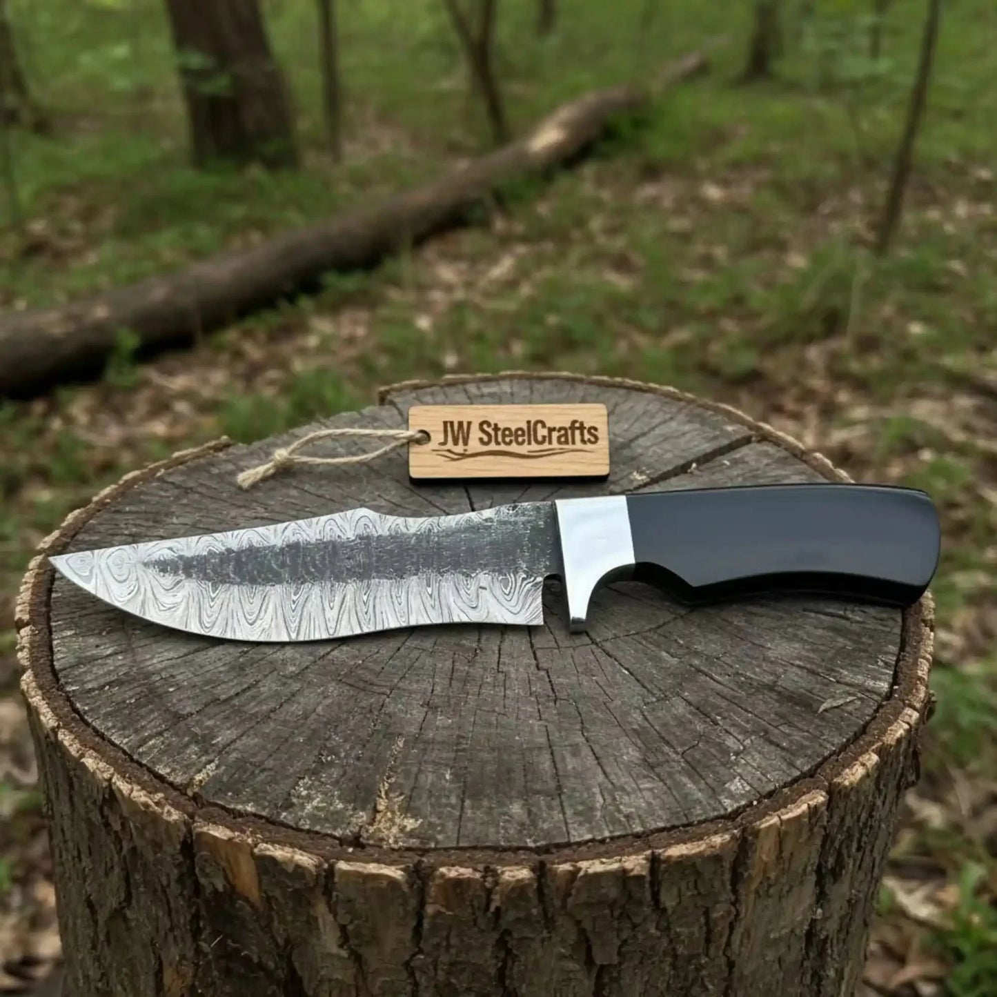 Damascus Trailing Point Fixed Blade Hunting Knife — Forged Ladder Pattern Blade, Black Resin Handle & Steel Guard