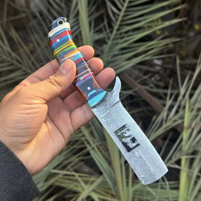 Damascus Bull Cutter Knife — Multi-Color Rainbow Resin Handle, Christian Cross Blade Engraving, Steel Bolster & Lanyard Hole